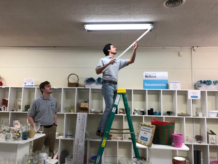 Students Installing T8 LED Lights During the Audit